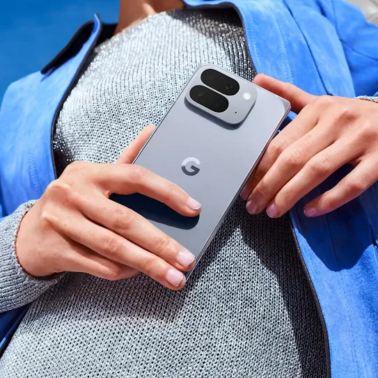 A Moonstone Google Pixel 10 Pro phone grouped together with the Google Pixel Buds Pro 2 and Google Pixel Watch 4.