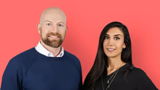 Cofounders Peter Fish and Shardi Nahavandi smile at a camera against a pink backdrop.