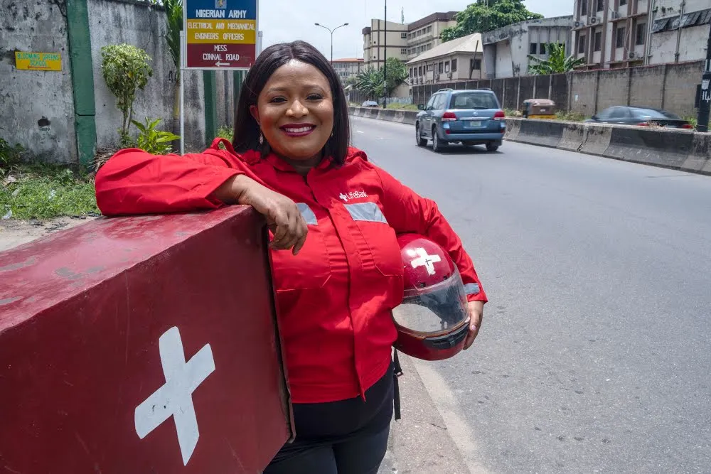 woman standing over case that is transporting health supplies