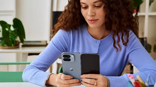 Woman using her Pixel 10 device indoors.