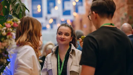 Photo of group of people convening at an event