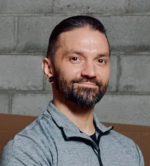 A photograph of Justin Gutowski, the Marketing Manager at Big L Windows and Doors, a home improvement and commercial supply company serving western New York.