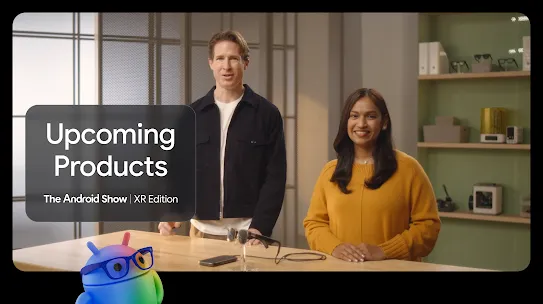 Two people standing at a table with Wired Glasses. 