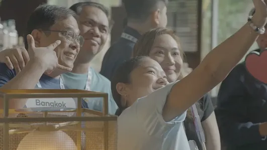 Waze Map Editor community members taking a group selfie at a meetup event in Bangkok