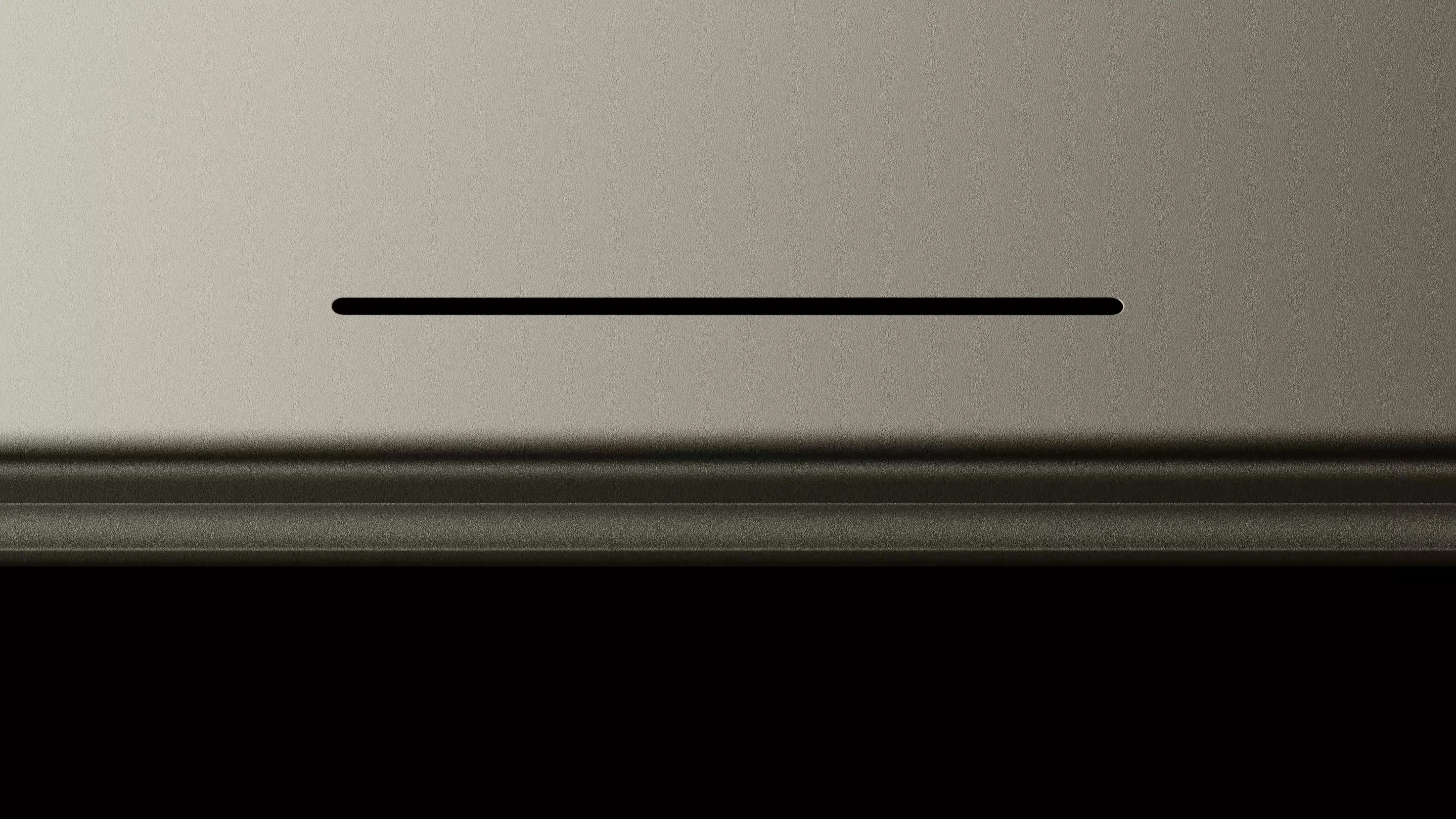 Close-up of the Googlebook glowbar lighting up as the device powers on.