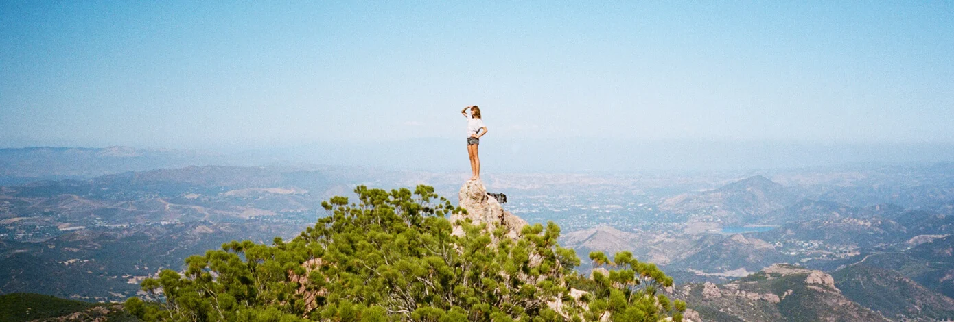 Woman top of Mountain