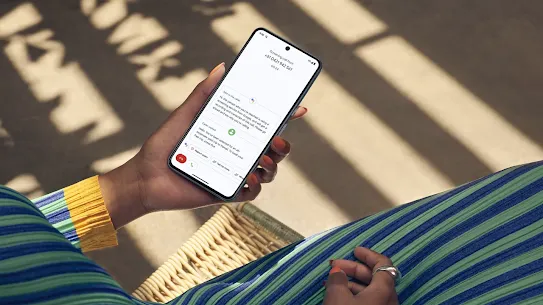 Woman uses her Android phone to send messages