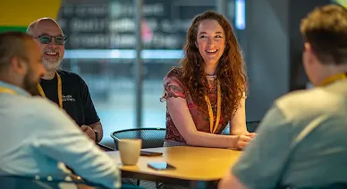 People seated at a table, enjoying a meaningful discussion.
