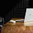 Googlebook open on a desk in a music studio with a mouse nearby.
