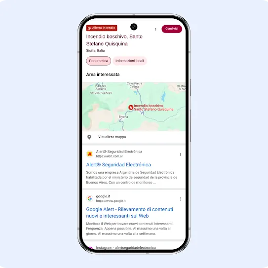 L'interfaccia di uno smartphone che mostra un'allerta Google per gli incendi nell'area metropolitana di Los Angeles. La dashboard mostra i dettagli sulla qualità dell'aria in California forniti da airnow.gov e NOAA, con una mappa interattiva dell'area, un indice della scala di colori IQA e aggiornamenti meteorologici ufficiali del National Weather Service che avvertono di un forte vento.