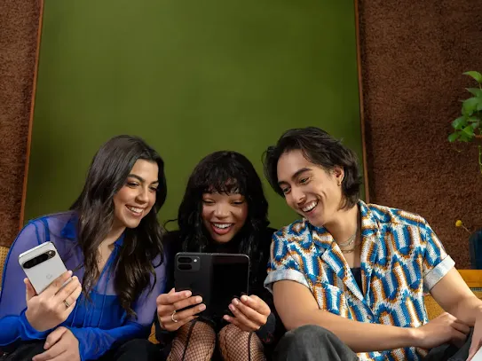 People sitting together holding their Android devices