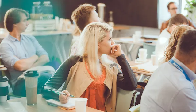 A lady is concentrating on a presentation.