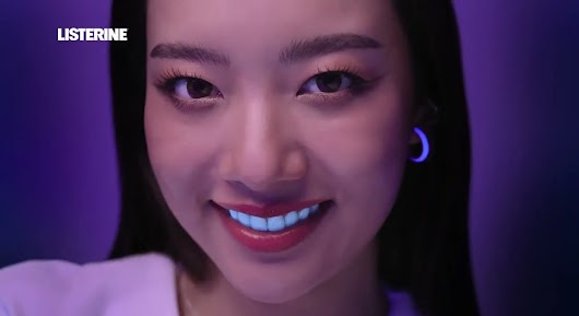 The video thumbnail shows a close-up, magnified view of a person's mouth and teeth, illustrating the presence of plaque even after brushing, to promote Listerine Total Care Zero mouthwash.