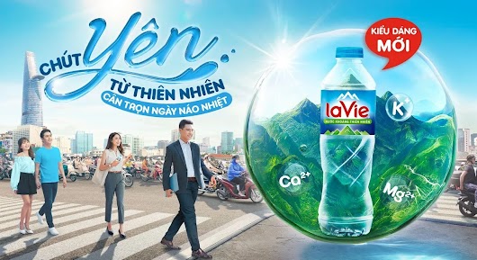 The video thumbnail shows a close-up of a clear glass bottle of La Vie natural mineral water with condensation, emphasizing its natural source and refreshing quality.