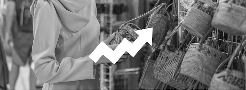 A woman purchasing woven bags at the local market in Indonesia