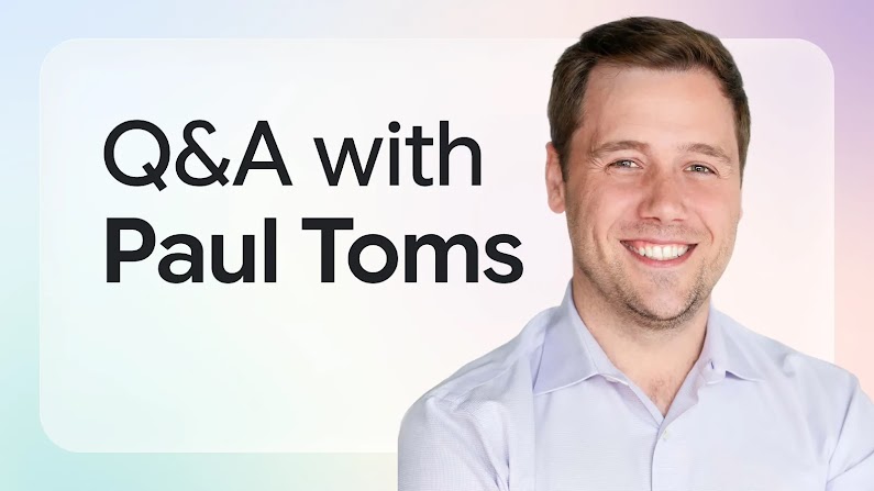 Graphic banner with bold text reading "Q&A with Paul Toms" set against an abstract, soft pastel gradient in shades of pale blue, green, and lavender. A headshot of Paul Toms smiling directly at the camera, wearing a light collared shirt.