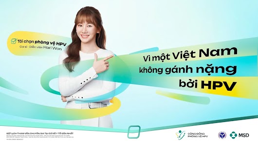 A smiling young woman pointing to Vietnamese text that reads "Vì một Việt Nam không gánh nặng bởi HPV" against a light blue background with green and yellow ribbon graphics.
