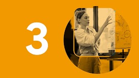 Chapter 3 of 6. A person with light skin and their long hair up in a bun, dressed in a white button-down shirt, motions toward a flowchart diagram on a whiteboard.