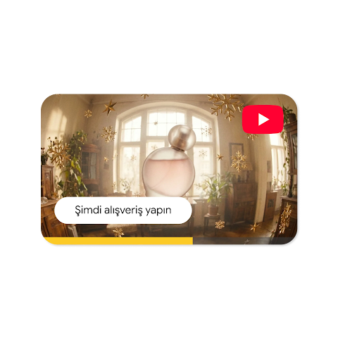 Açık pembe bir parfüm şişesinin ve "Şimdi alışveriş yap" düğmesinin yer aldığı YouTube video reklamı.