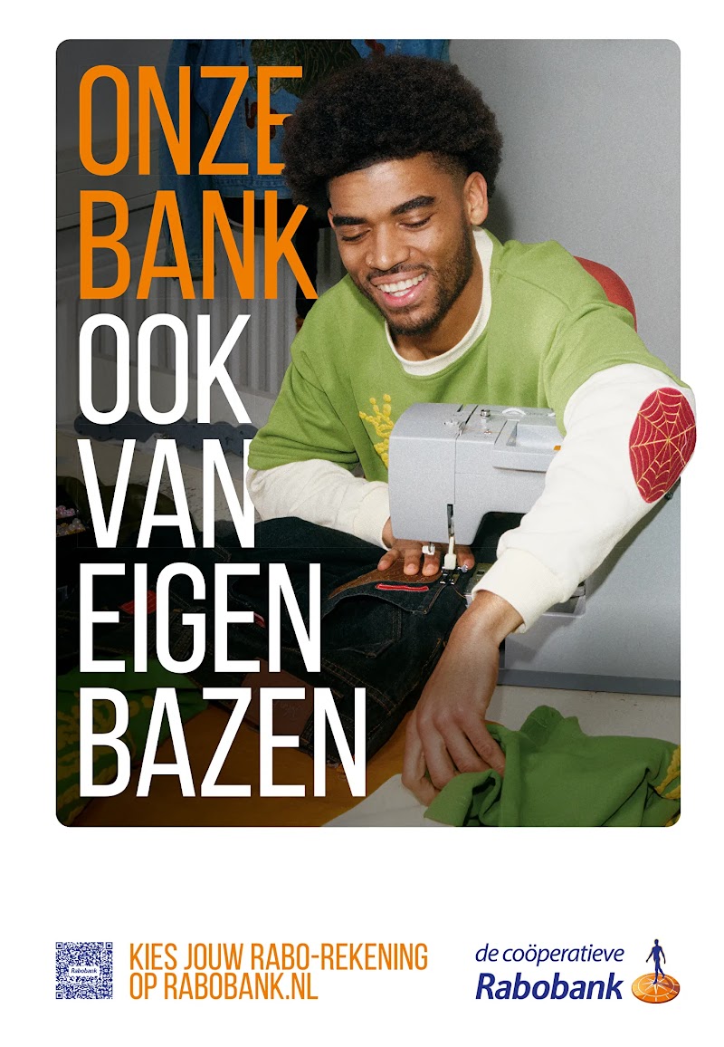 A young man smiles while using a sewing machine on dark fabric, with large text reading "ONZE BANK OOK VAN EIGEN BAZEN". Below, text reads "KIES JOUW RABO-REKENING OP RABOBANK.NL" next to a QR code and the Rabobank logo. 