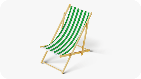 Foldable wooden outdoor chair with a green and white striped fabric sling seat.