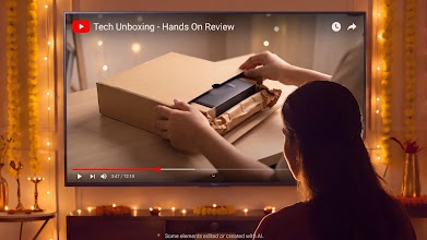 A person watching a 'Tech Unboxing - Hands On Review' video on a smart TV in a festively decorated living room