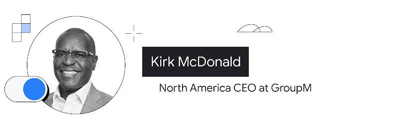 GroupM'in Kuzey Amerika CEO'su Kirk McDonald'ın, omuzlarından yukarısı görünecek şekilde fotoğrafına yer verilmiştir. Koyu tenli, kısa siyah saçlıdır. Gözlük takıyor ve desenli ceketinin altında yakalı bir beyaz gömlek giyiyor.