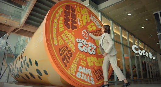 The video thumbnail shows a vibrant, refreshing image of a CoCo Fresh Tea & Juice drink, emphasizing relief from stress.