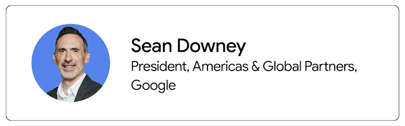 Sean Downey, president of Americas and Global Partners at Google, appears from the shoulders up. Downey has dark hair, light skin, and wears a black suit jacket with a white shirt.