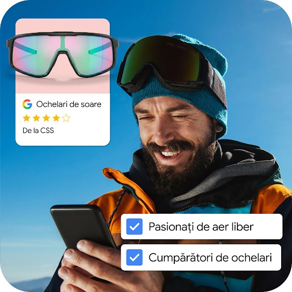O imagine compusă care arată un bărbat într-o geacă de iarnă portocalie cu negru și o căciulă albastră, zâmbind în timp ce se uită la smartphone-ul său. El poartă ochelari de schi negri pe cap. Suprapuse pe imagine sunt două casete de selectare bifate, etichetate „Entuziaști ai activităților în aer liber” și „Cumpărători de ochelari”. Un card de produs în stânga sus afișează o pereche de ochelari de soare sport reflectorizanți, iridescenți, cu un logo Google, o evaluare de 4 stele și textul „Ochelari de soare”.
