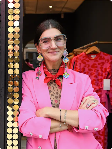 Lucy Aylen of Never Fully Dressed stands outside her shop.