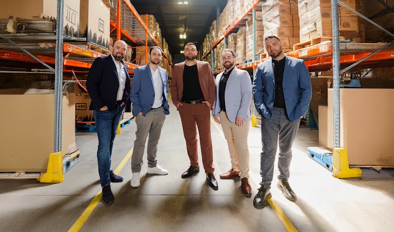 The Transformer Table team pictured in their warehouse