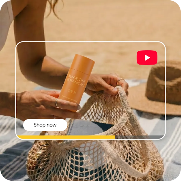 Close-up of hands placing an orange sunscreen bottle into a beach bag, overlaid with a YouTube video player interface.