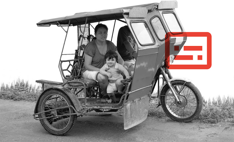A Filipino family with a young child getting around in a tricycle
