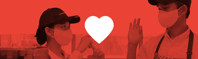 Two Starbucks baristas in Korea using sign language to communicate with one another to ensure greater inclusivity and accessibility for all customers