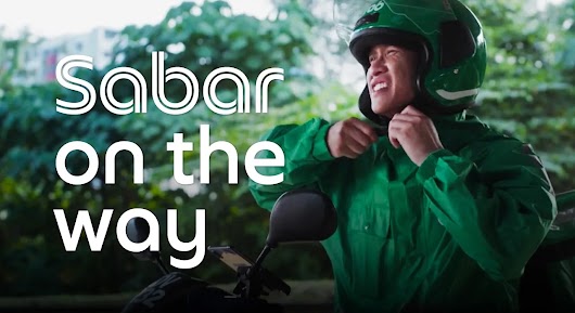 YouTube Works Awards Southeast Asia 2026 Winner card for the 'Best of Festive' category, showcasing Grab Malaysia’s campaign 'Sabar’s On The Way' by M+C Saatchi Performance, Grab Creative Studio, and Layar Lucida. The visual depicts a hand holding a smartphone showing a humorous customer interaction with a Grab driver named Sabar.