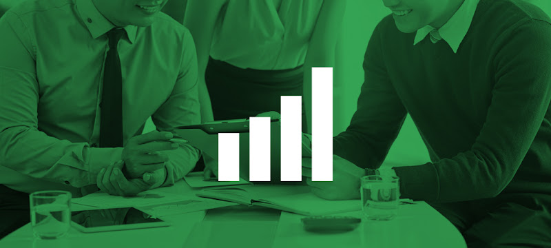 Two people in a Singapore office looking at a tablet