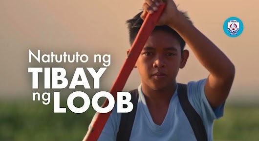 The video thumbnail shows a scene illustrating a child's determination and strength of character, possibly traveling to school by boat, as part of a Nestlé campaign.