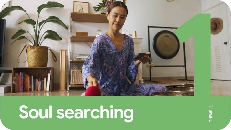 Theme 1: Soul searching. A woman with a phone in one hand practicing gong meditation.