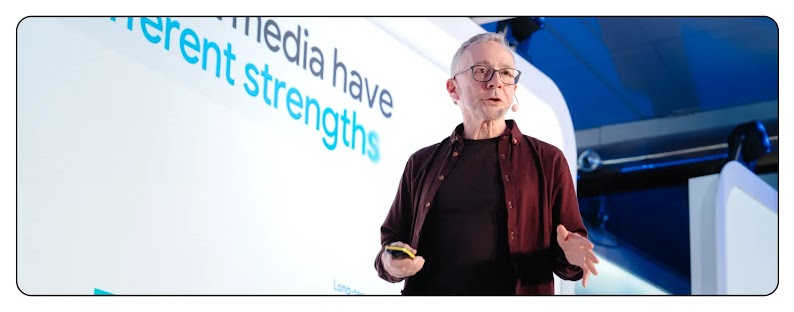 A photo of Les Binet on stage, speaking at the Think 2025 event in Stockholm.
