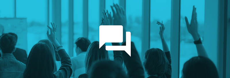 Multiple people raising their hands at once during a professional presentation