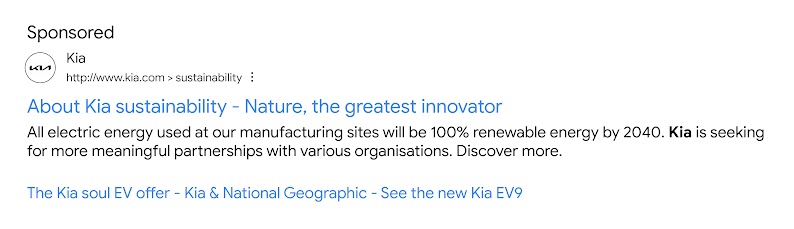 A sponsored search result for kia.com. The title link reads: “About Kia sustainability: Nature, the greatest innovator”. The snippet focuses on Kia’s efforts to make the electric energy they use 100% renewable by 2040. Below, three sitelinks.