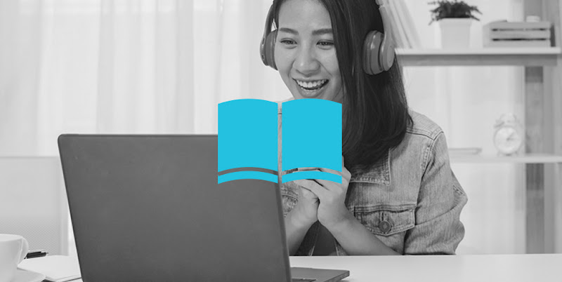 A Hong Kong lady smiling while video calling on her laptop with headphones on