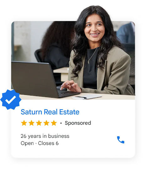 A local ad shows a realtor working on a laptop.