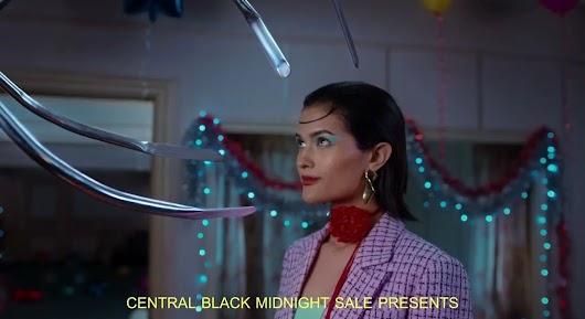 The video thumbnail shows a young woman happily opening a shopping bag full of items, promoting the "DIY Give It Yourself" theme for the Central Black Midnight Sale.