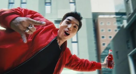 The video thumbnail shows Vietnamese rapper HIEUTHUHAI looking energetic and charismatic, with the red and yellow logo of Sting energy drink in the foreground.