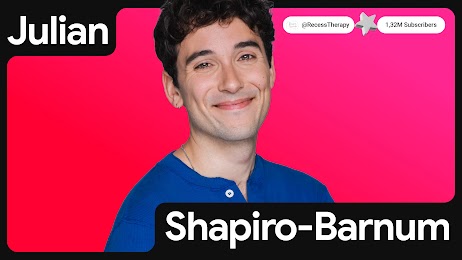 Julian Shapiro-Barnum appears in front of a red background. His name and YouTube handle, Recess Therapy, appear in bold white text. Shapiro-Barnum has light skin, dark wavy hair, and smiles.