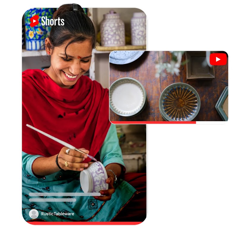 A smiling woman wearing a red shawl decorating a white ceramic bowl. The image is framed within a vertical YouTube Shorts player interface, showing a progress bar and a user profile icon labeled "RusticTableware." Overlaid on the top right is a smaller horizontal video player showing finished pottery plates on a wooden table.