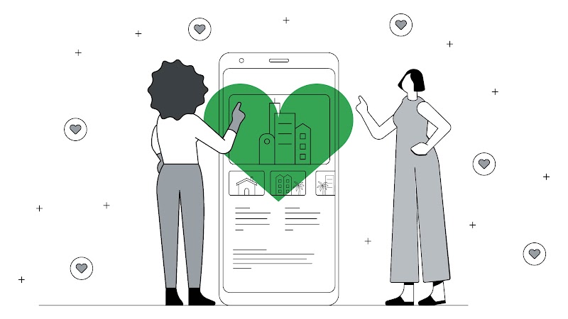 Dos mujeres interactúan con un smartphone gigante, donde se ve una aplicación con imágenes de hoteles y un gran corazón verde.