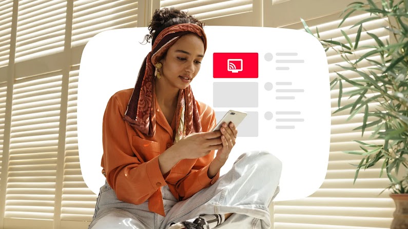 Woman wearing a headscarf sits cross-legged using a smartphone next to a digital interface graphic showing a red TV casting icon and video list items.